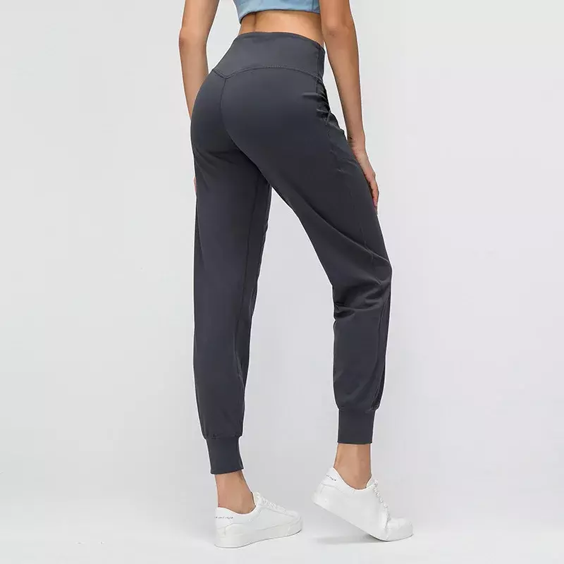 Nowy kolor skóry przyjazne luźno dopasowane damskie spodnie do jogi, elastyczne fitness dopasowane legginsy sportowe przycięte spodnie z nadrukowane logo