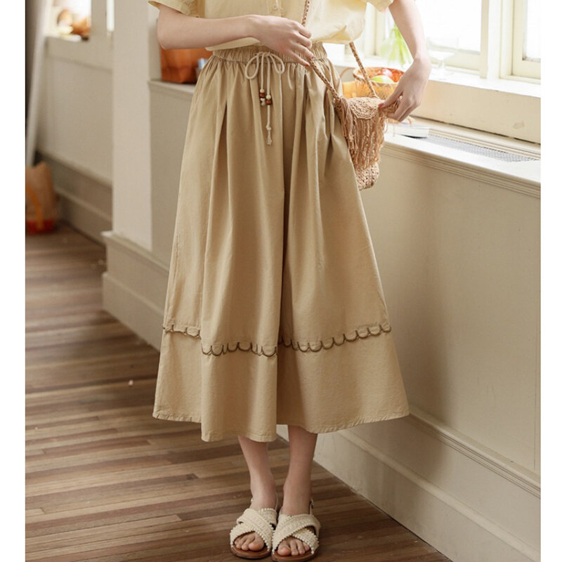 Rok wanita gaya Preppy 2024, desain baru rasa pinggang tinggi elastis renda, rok A-line longgar kasual serbaguna