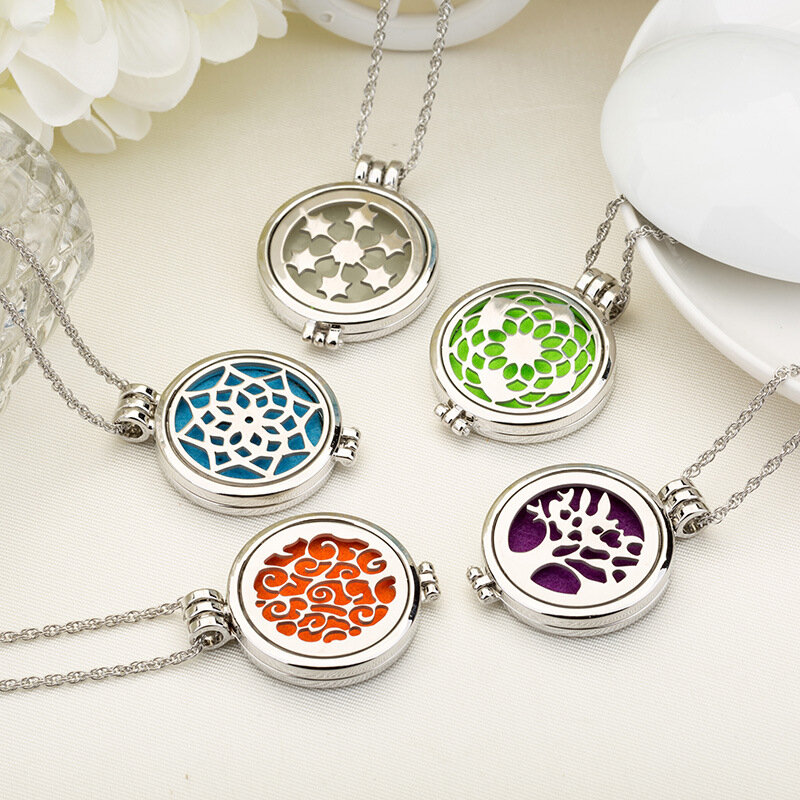 Hot selling hollow and luminous aromatherapy necklace, fashionable stainless steel diffuser photo box DIY pendant