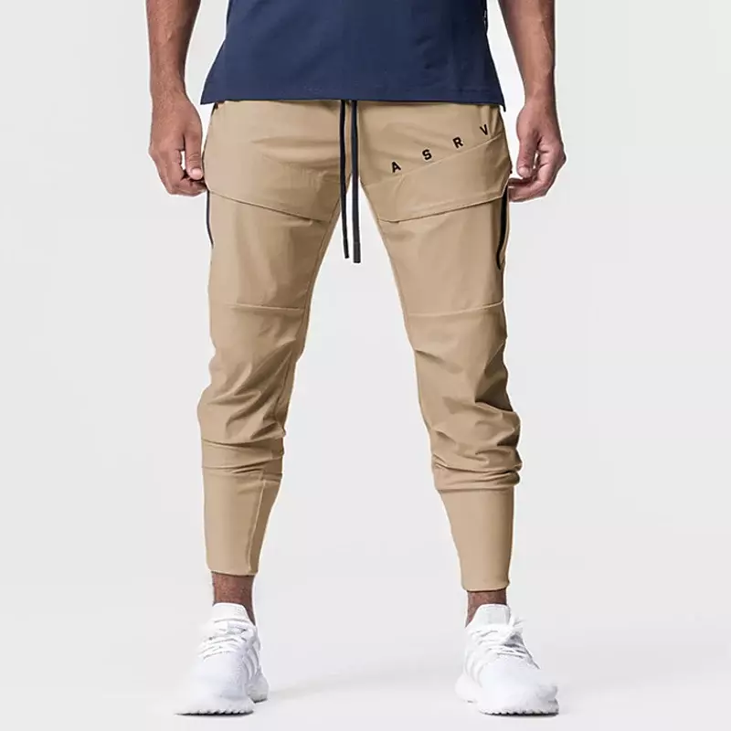 Codzienne męskie spodnie popularnej marki sportowe na siłownię spodnie do joggingu spodnie Cargo z wieloma kieszeniami szybkoschnący spodnie Fitness dresy treningowe