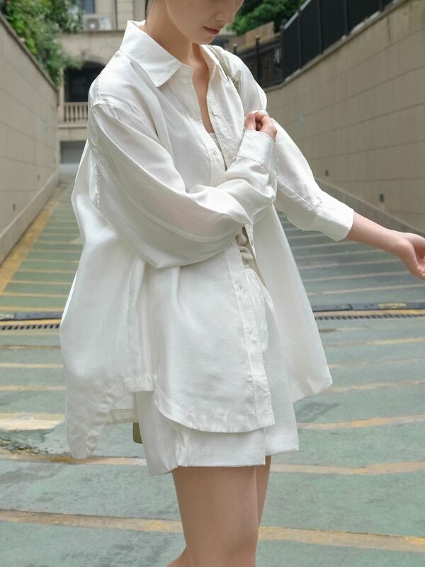Spring and summer women's casual solid color lapel long sleeved pocket decoration loose shirt