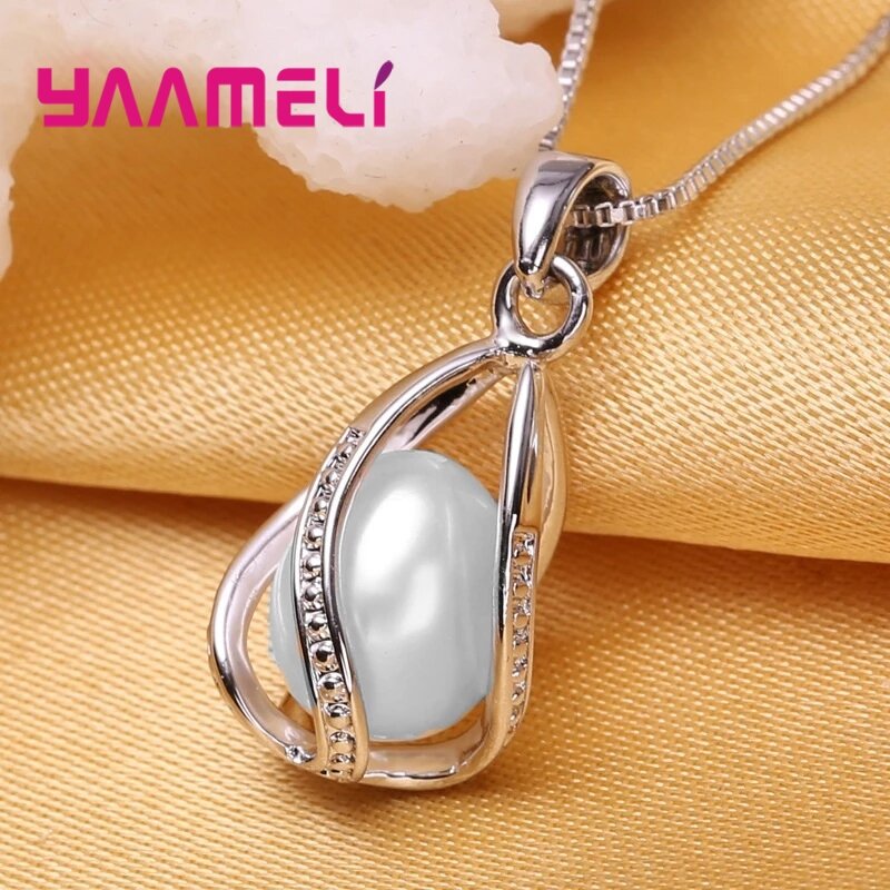 Elegante conjunto de joyas de plata de ley 925 para mujer, colgante de perlas de agua dulce giratorio, collar, pendientes Huggie