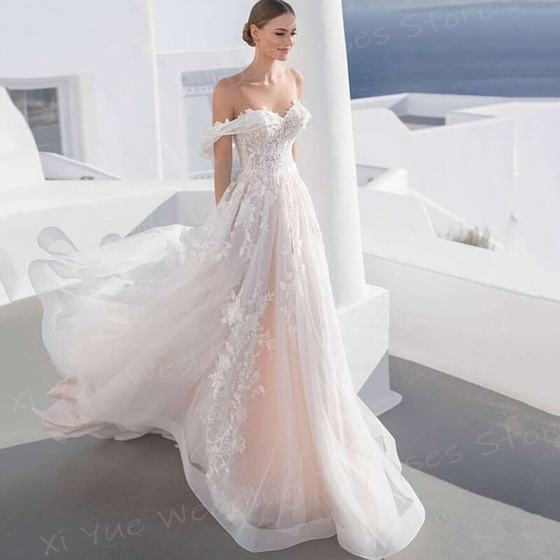Romantyczne eleganckie damskie suknie ślubne damskie seksowne z odkrytymi ramionami koronkowe aplikacje suknie panny młodej Illusion Beach Vestido De Noivas