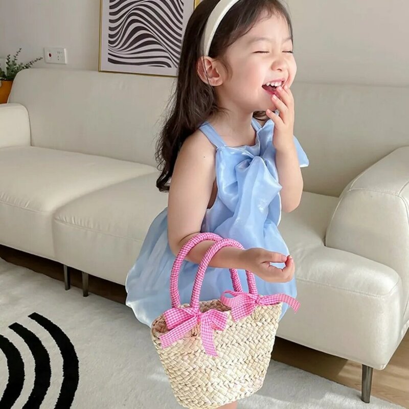 韓国風の子供用ハンドバッグ、蝶ネクタイ付きの甘い麦わら、お出かけバッグ、小さなバスケット、子供用手作りストローバッグ