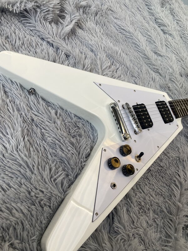 High quality electric guitar, V-design, silver lacquer, HH pickups, fingerboard mother-of-pearl inlay. Free shipping in stock