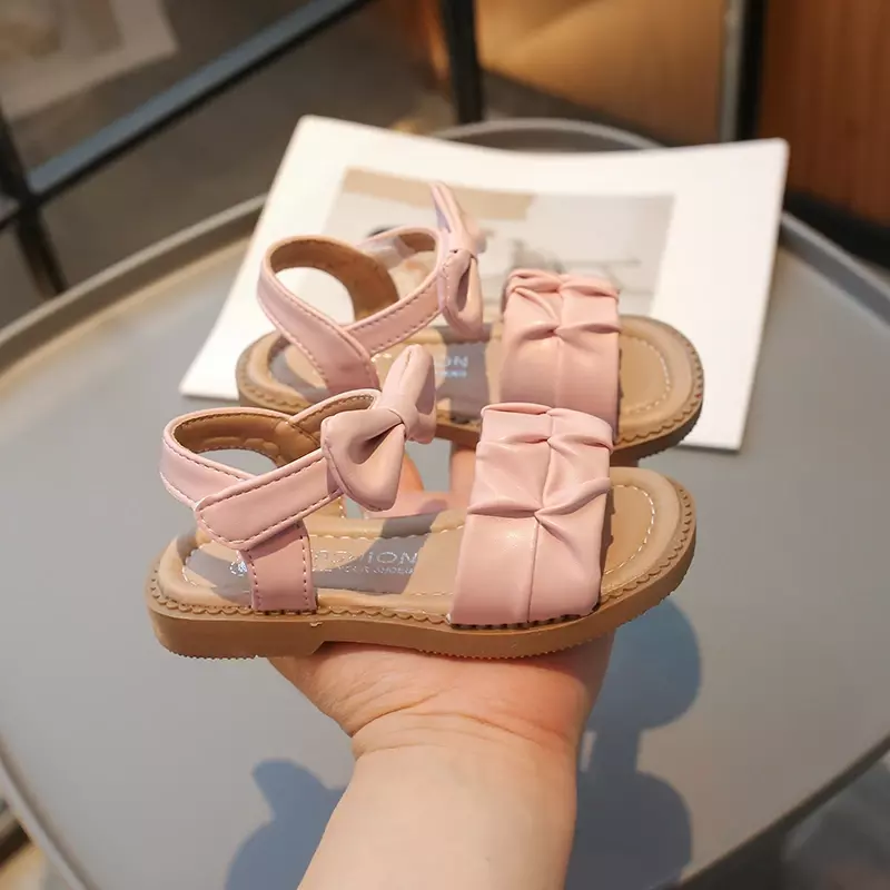 Sandały dziecięce dla dziewczynek letnia plisowana księżniczka z odkrytymi palcami modne płaskie sandały jednokolorowe dziecięce sandały plażowe uniwersalne