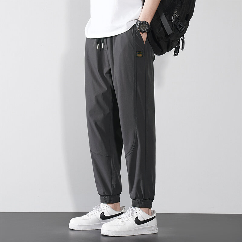 Trendy Summer Men's Solid Pockets Drawstring Elastic Waist Ice Silk Fabric Loose Bound Feet Wide Leg Trousers Ankle Length Pants