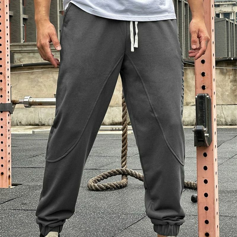 2024 nowa, w stylu streetwear na co dzień modne męskie spodnie z modnym wzorem z wytłoczonym logo casualowe spodnie fitness sportowy luźna odzież męska