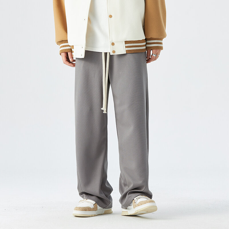 Nowe męskie wiosenne i jesienne luźne proste spodnie młodzieżowe w jednolitym kolorze modne uniwersalne spodnie męskie