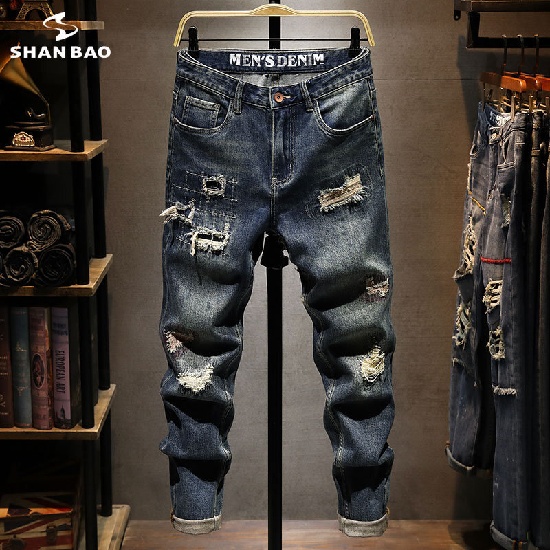 Wiosenne i jesienne nowe jeansy męskie z dziurami Slim Fit mała stopa długie spodnie Trend młodzieżowy uniwersalne jeansowe styl osobowości męskie