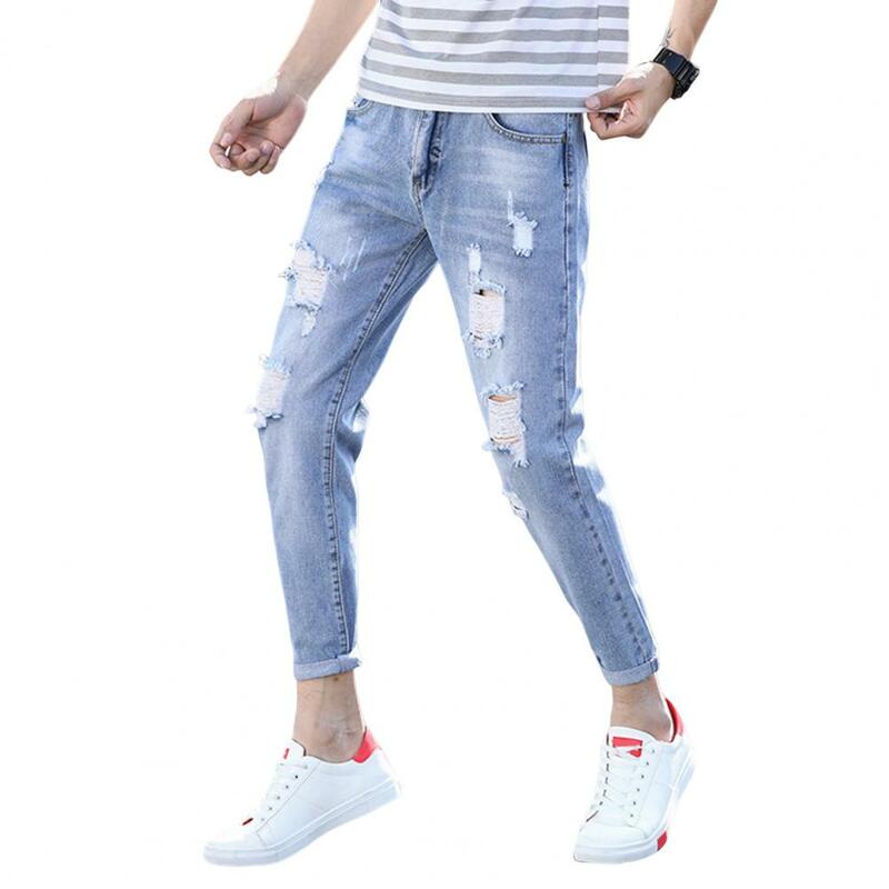 Calças jeans de origem média estilo coreano para homens, botão, zíper, bolsos voadores, furos rasgados, streetwear slim fit