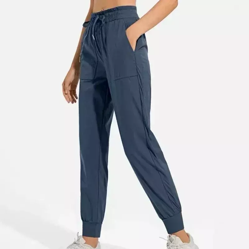 Cytrynowe damskie spodnie sportowe ze średnim stanem cienka, oddychająca tkanina luźny krój spodnie do biegania z kieszeniami Fitness spodnie do jogi