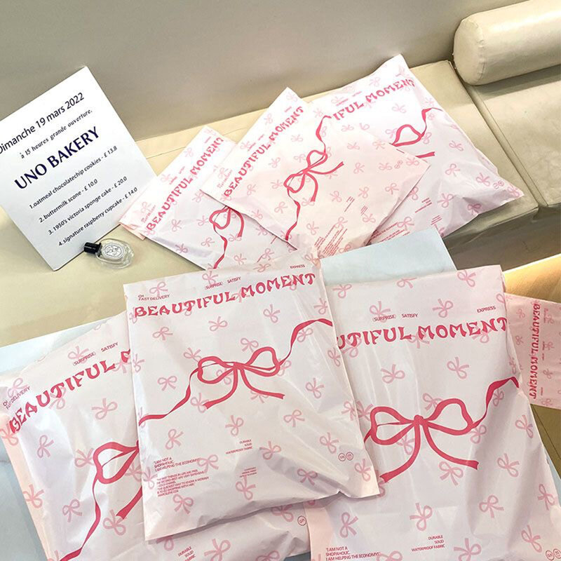 50 шт. Розовые Пластиковые курьерские пакеты с бантом, печатный Экспресс-конверт, упаковка для одежды, конверты для доставки, самоклеящиеся почтовые пакеты