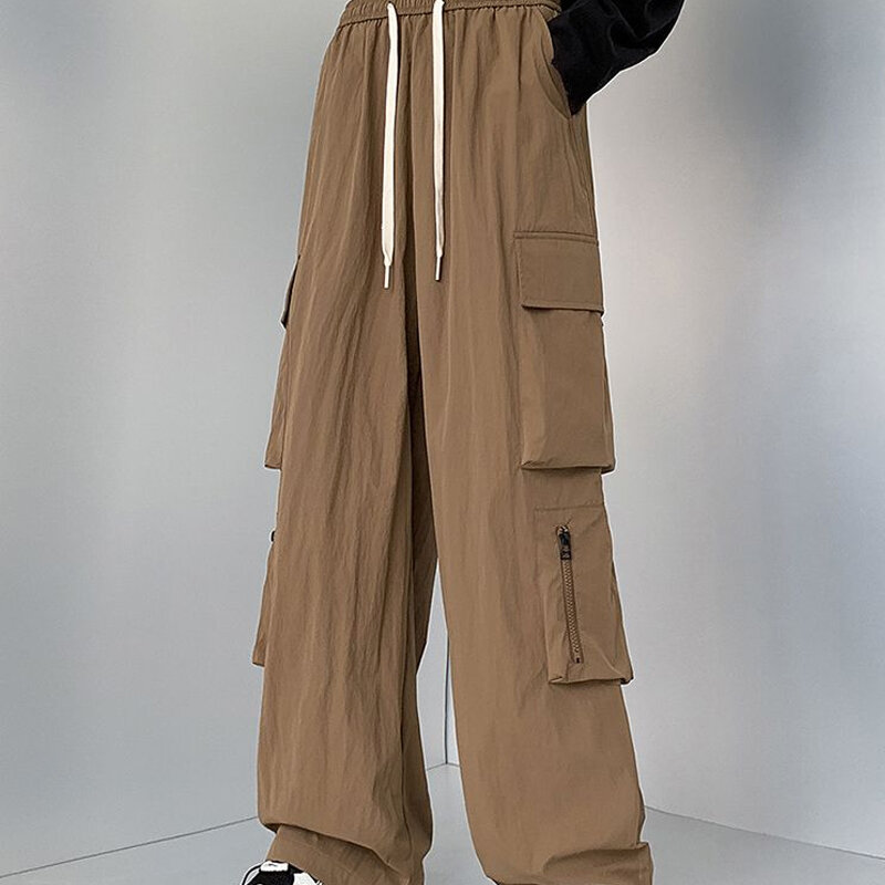 Primavera autunno tinta unita moda elastico in vita pantaloni dritti uomo High Street Casual tasche larghe pantaloni con coulisse con cerniera