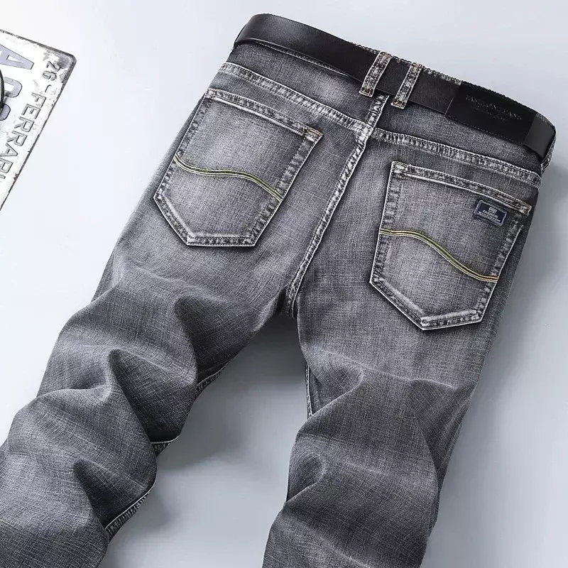 Klasyczne letnie męskie cienkie jeansy moda biznesowa wysokiej jakości Stretch dżinsowe proste spodnie męskie spodnie markowe