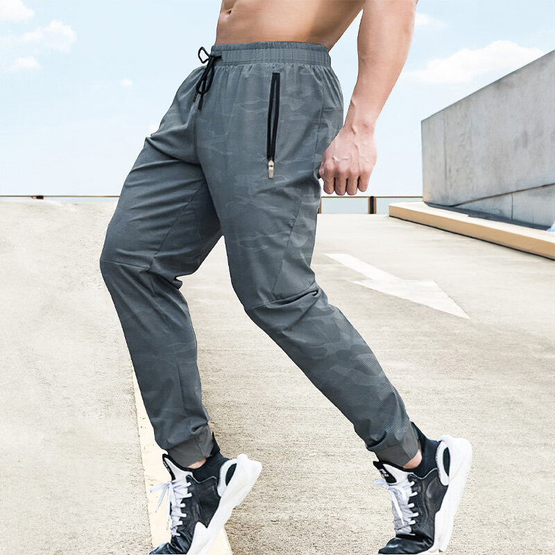 Rozciągliwe męskie spodnie dresowe siłownia szybkoschnące spodnie do biegania trening na świeżym powietrzu Jogging spodnie na co dzień męskie spodnie dresowe z kieszenią na zamek
