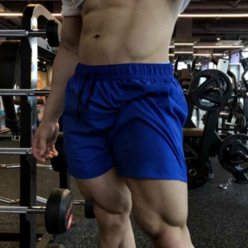 Pantaloncini Casual estivi da uomo pantaloncini Fitness elastici in vita con coulisse pantaloncini sportivi a gamba larga ad asciugatura rapida