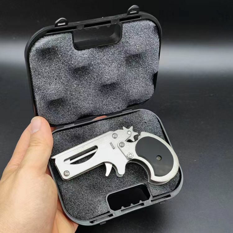 1 pz pistola giocattolo in acciaio inox Mini pieghevole elastico giocattolo sport all'aria aperta portachiavi giocattolo in gomma pistola per regali Boyfriend