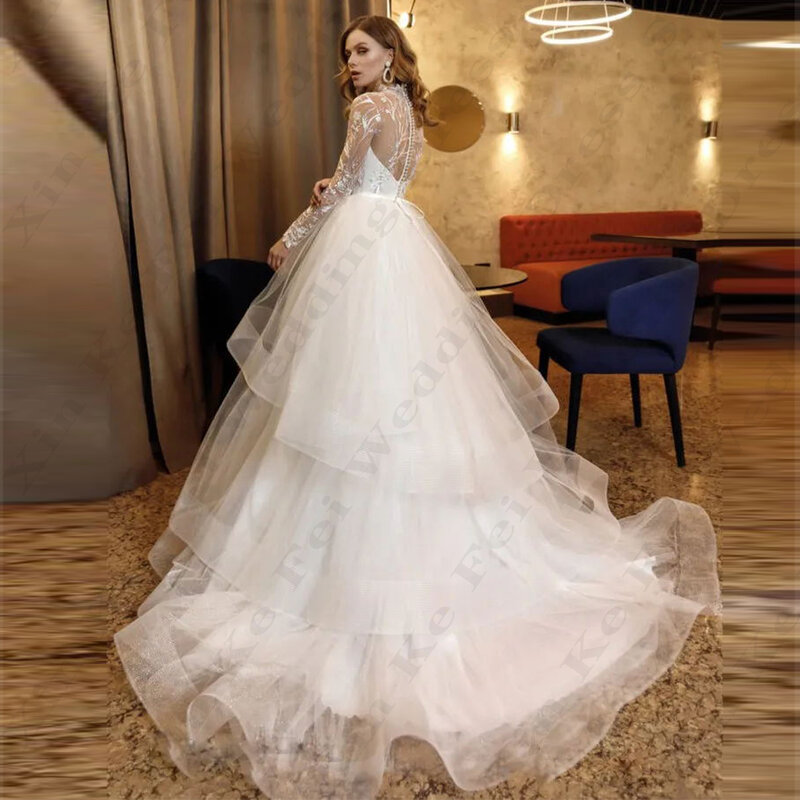 Eleganckie damskie suknie ślubne tiulowe na szyję z długim rękawem koronkowa aplikacja ślub księżniczki sukienka formalna impreza na plaży Vestido Novia