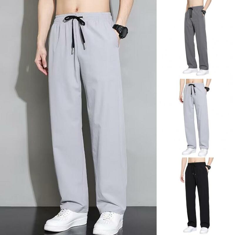 Calça esportiva casual de secagem rápida masculina com bolsos laterais, cintura com cordão, treino de ginástica, calça de jogging