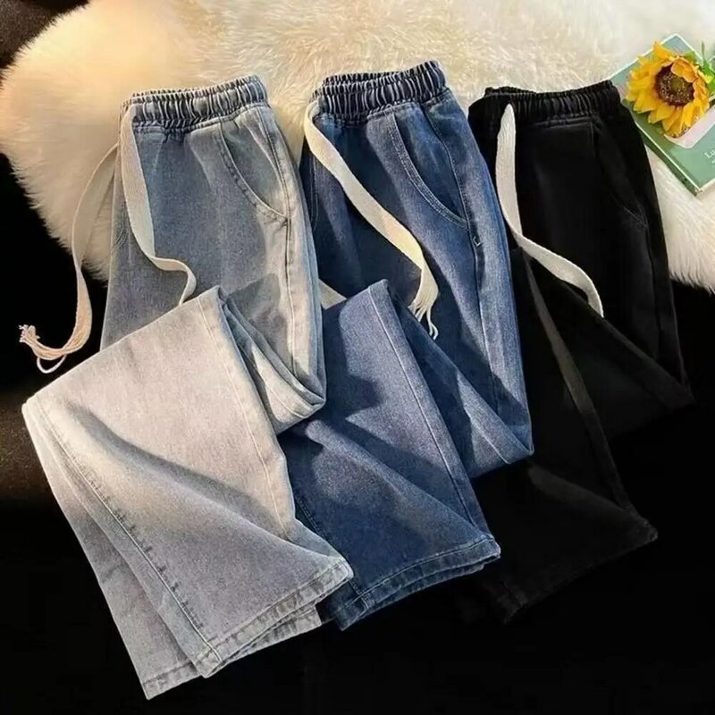 Spodnie dżinsowe z szerokimi nogawkami dla mężczyzn elastyczny sznurek do ściągania talii jeansy z kieszeniami luźny krój na co dzień