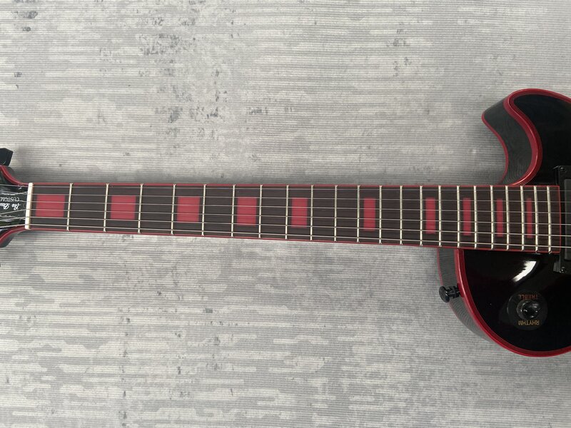 Electric guitar, have Gib$on logo, big red pattern veneer, red logo red Mosaic, made in China.. Mahogany body, free shipping