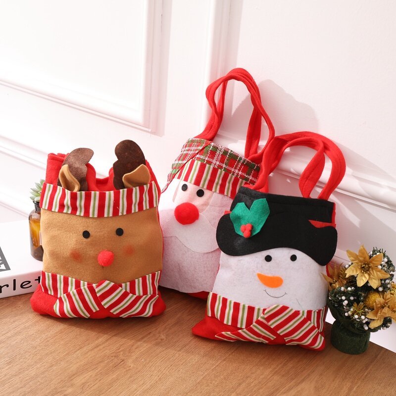 Santa claus不織布のハンドバッグ、雪だるまのギフトバッグ、キャンディーの装飾