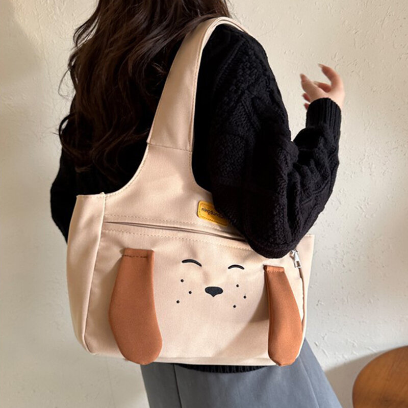 Bolso de hombro de lona con dibujos animados para mujer, bolsa versátil de gran capacidad con diseño de perro bonito, a la moda, novedad