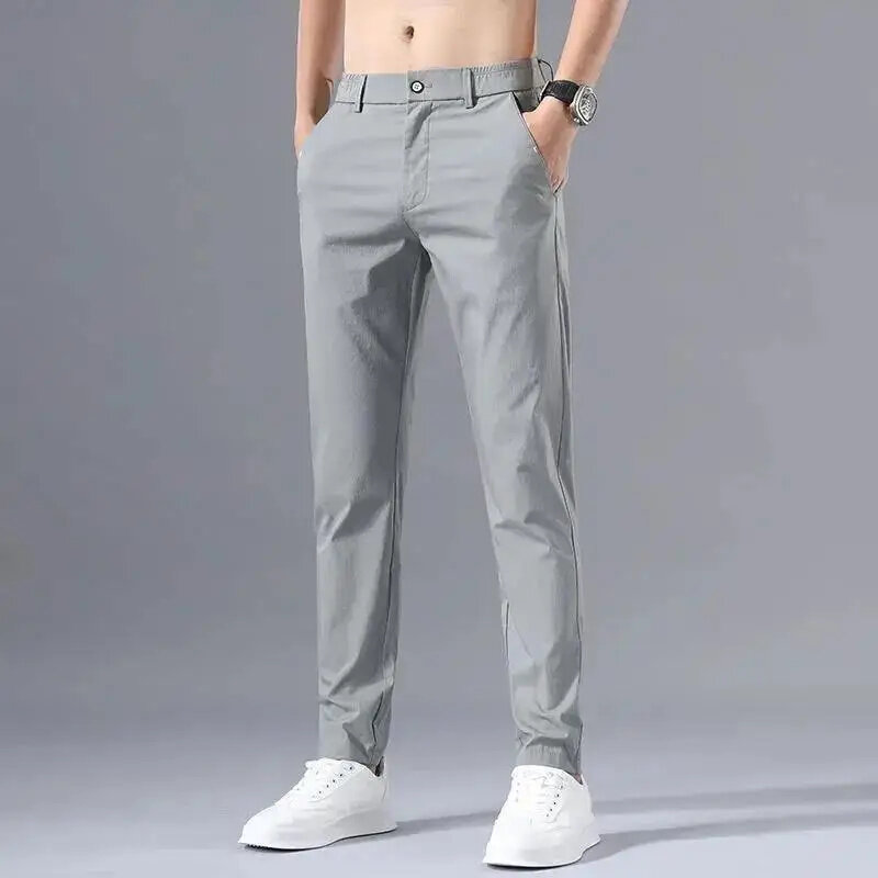 กางเกงลำลองขาตรงเอวกลางมีกระเป๋าของผู้ชายสไตล์เกาหลีกางเกงสีทึบบางตรงมีซิปใหม่สำหรับฤดูร้อนของ2024