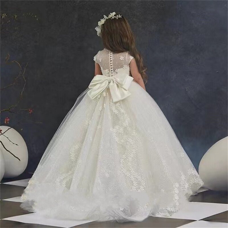 2023 Flower Girl Dresses o-collo Tulle Bow Lvory comunione per il matrimonio pageant lunghezza del pavimento abito da ballo Cute Ball personalizza