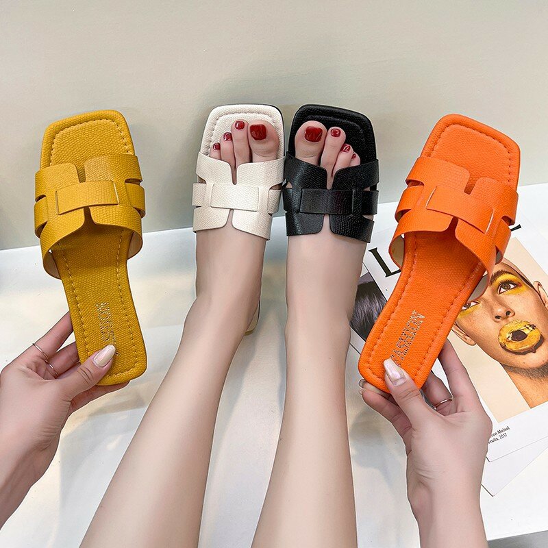 2024 lato nowy seksowny projekt mody klapki damskie płaskie kapcie na zewnątrz antypoślizgowe z wystającym palcem plażowe damskie sandały damskie buty