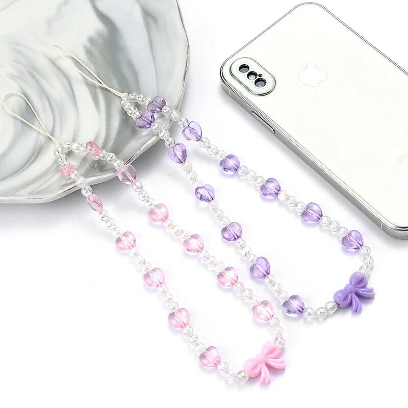 Moda dolce acrilico trasparente catena del telefono cuore fiocco perline gioielli cinturino telefonico per Anti-goccia donne ragazze cellulare cordino