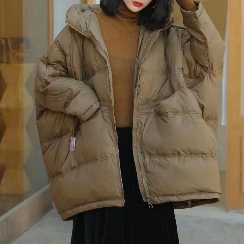 Piumino 2023 nuovo stile da donna in piuma d'anatra bianca con coulisse con cappuccio versione coreana sciolto semplice e Versatile tendenza del cappotto