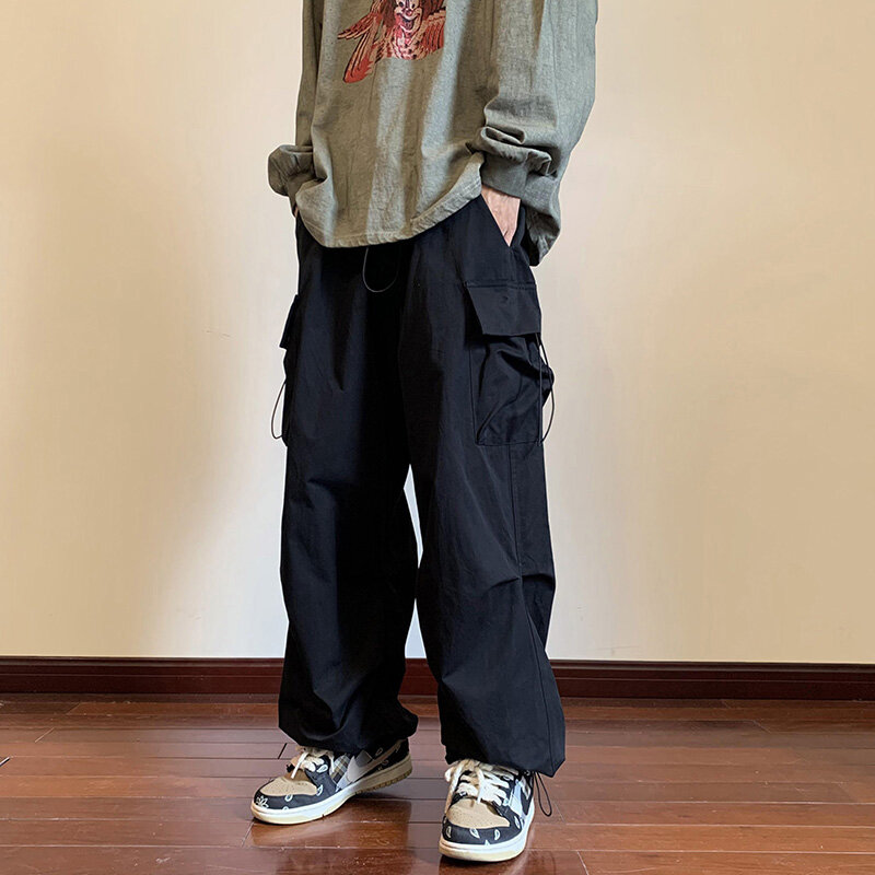 Streetwear 2023 primavera Harem pantaloni Casual uomo elastico in vita tinta unita pantaloni Cargo Multi tasca pantaloni larghi larghi per le donne