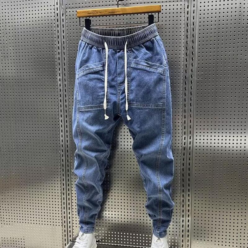 Wiosna jesień męskie dżinsy elastyczny sznurek w pasie spodnie kieszenie projekt spodnie dżinsowe jednokolorowe Casual Cargo spodnie haremowe