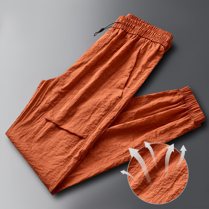 Modne elastyczne kieszenie łączone jednokolorowe spodnie na co dzień odzież męska 2024 letnie nowe luźne spodnie w młodym stylu z wysokim stanem