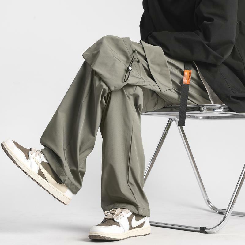 2023 nuovi pantaloni da corsa impermeabili pantaloni Cargo Casual da uomo di tendenza in tinta unita moda Casual versatili pantaloni larghi coreani 5Xl