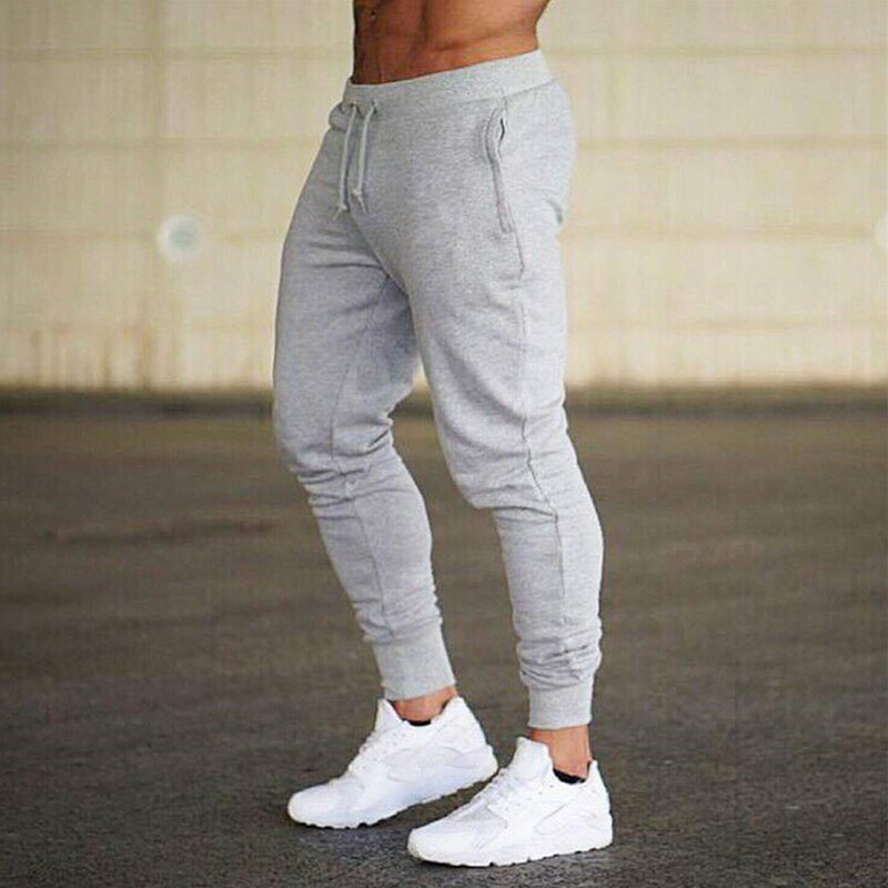 กางเกงวอร์มผู้ชายเอวยางยืดกางเกงจ๊อกกิ้งสีพื้นน้ำหนักเบาและระบายอากาศได้ดีเหมาะสำหรับทุกฤดูกาล