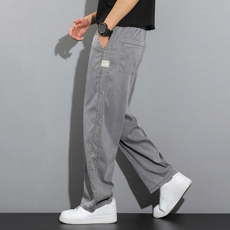 Celana panjang kasual pria, bawahan olahraga kaki lebar gaya Jepang dengan saku samping warna Solid Gym untuk Jogging