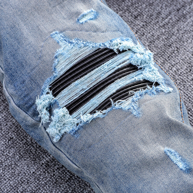 Główna ulica modne dżinsy męskie niebieskie w stylu Retro rozciągaj chudy krój porwane jeansy mężczyzn skórzany projektant Hip Hop markowe spodnie Hombre