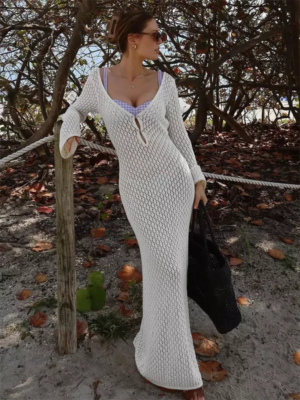 Glänzende weiße Strick mode vertuschen Maxi kleid weibliche durchsichtige V-Ausschnitt aushöhlen Strand Urlaubs kleid Strickwaren rücken freies Kleid