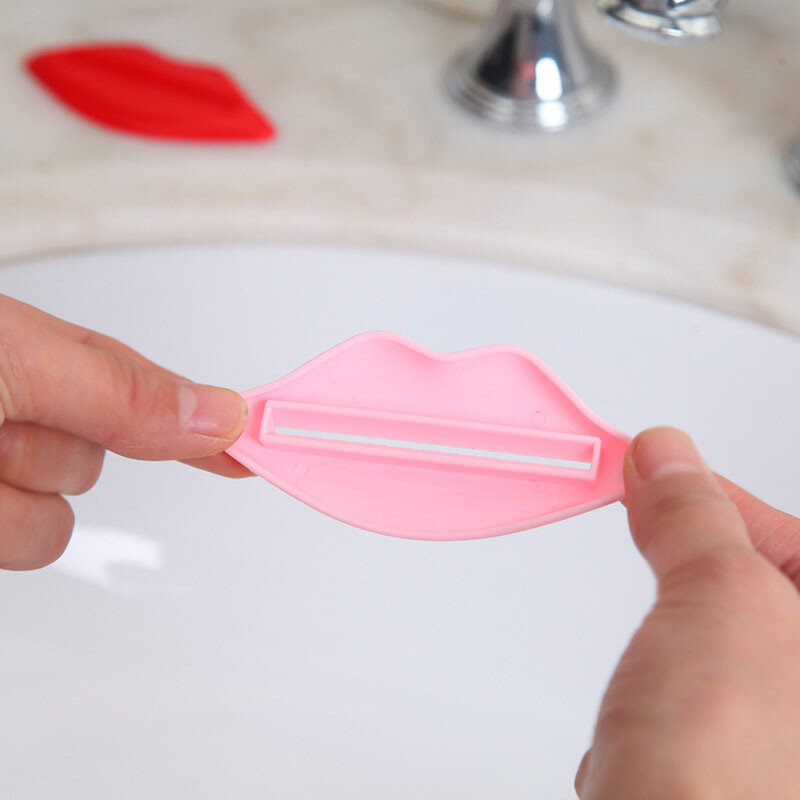 Venda quente tubo de creme dental squeezer lábio forma dente pasta dispenser creme rolo squeezer cor aleatória ferramenta limpeza oral