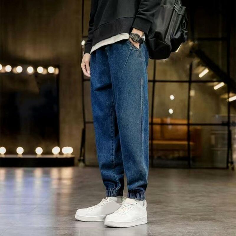 Jeans masculino solto elástico na cintura, Jeans com faixas no tornozelo, cor sólida, bolsos de ganga, comprimento