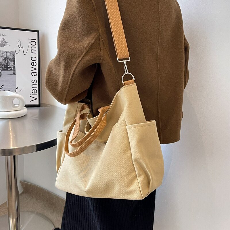 Tas selempang bahu tunggal wanita, tas selempang kanvas angin malas warna polos versi Korea baru, tas wanita simpel