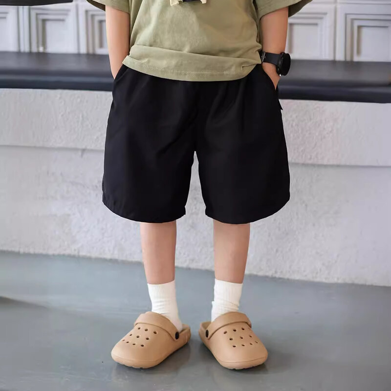 Pantalones cortos informales para niños y niñas, pantalón holgado de Color liso, estilo coreano, novedad de verano, 2024
