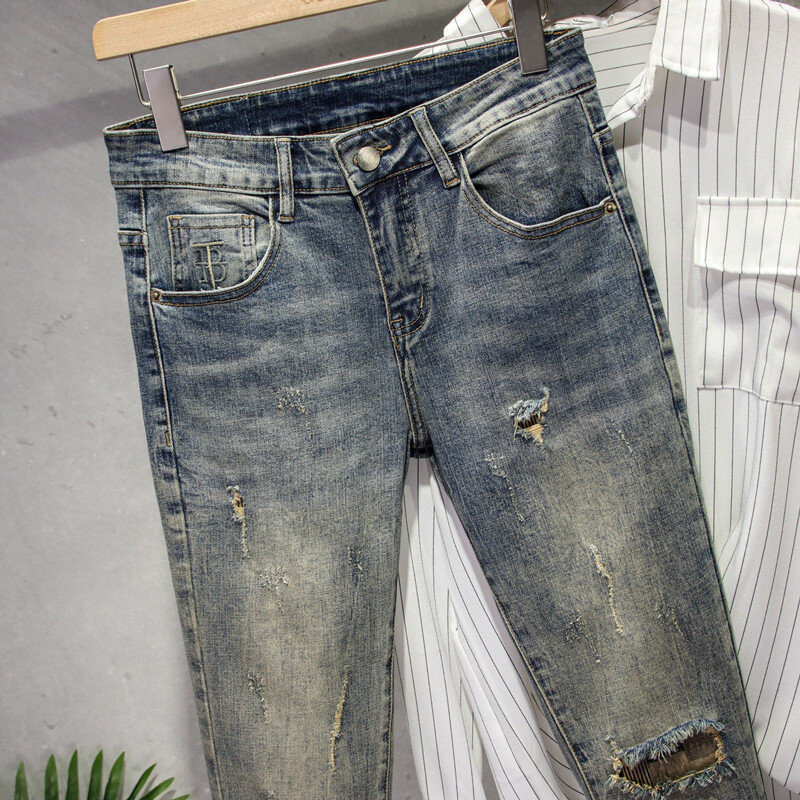 Celana Jeans Denim gaya Korea pria, celana Denim pensil ramping, celana desainer mode elastis Musim Semi dan Gugur