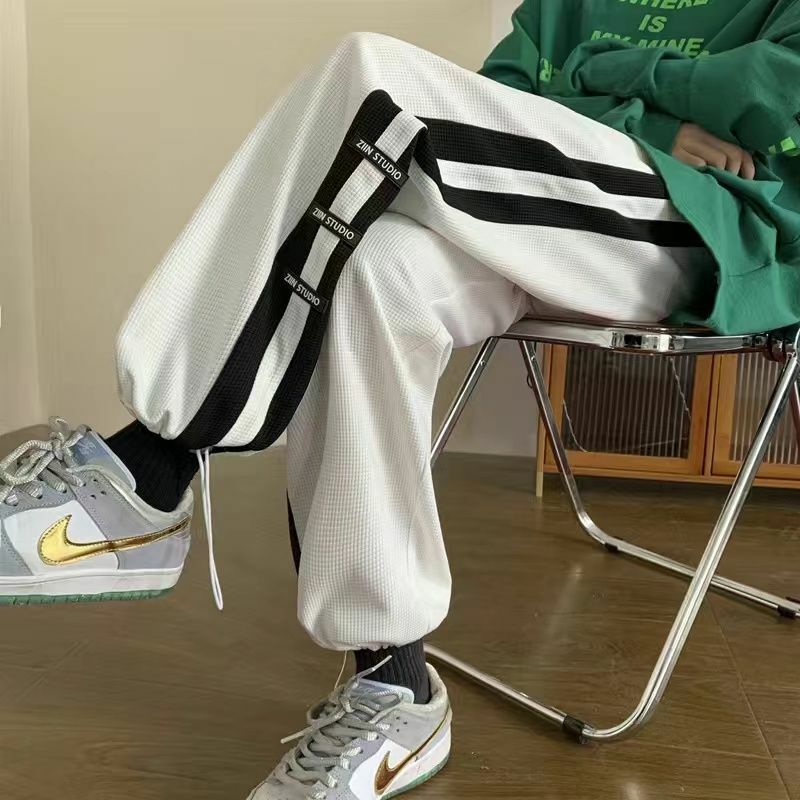 W koreańskim stylu na lato sportowe spodnie retro amerykańska ulica hip hop męskie w paski luźne spodnie sportowe z prosta szeroka nogawkami