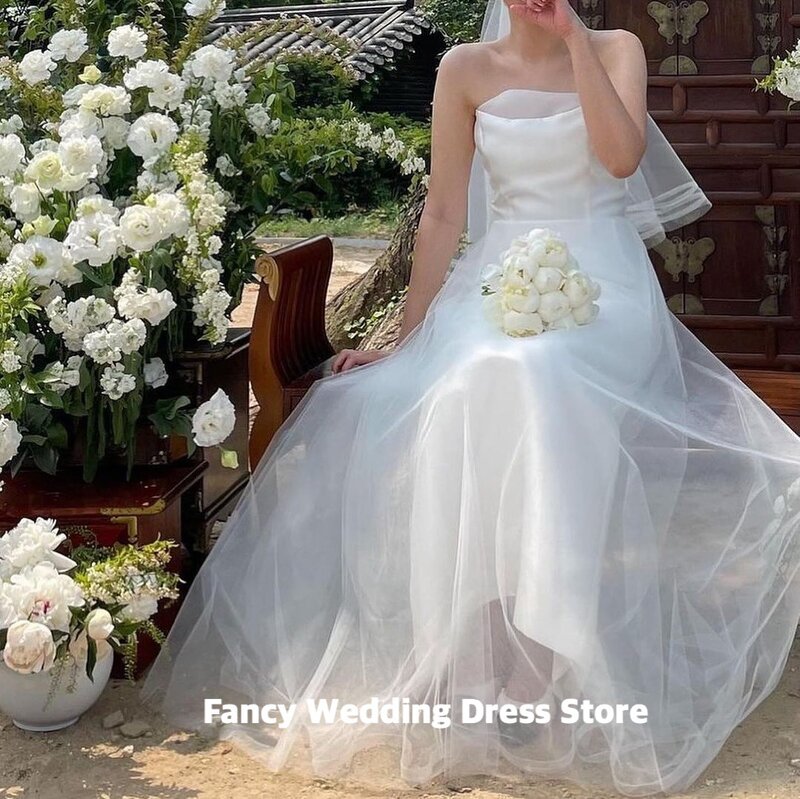 Fantazyjne proste suknie ślubne z organzy bez ramiączek bez rękawów o długości podłogi suknie ślubne dla koreańskich sesja zdjęciowa