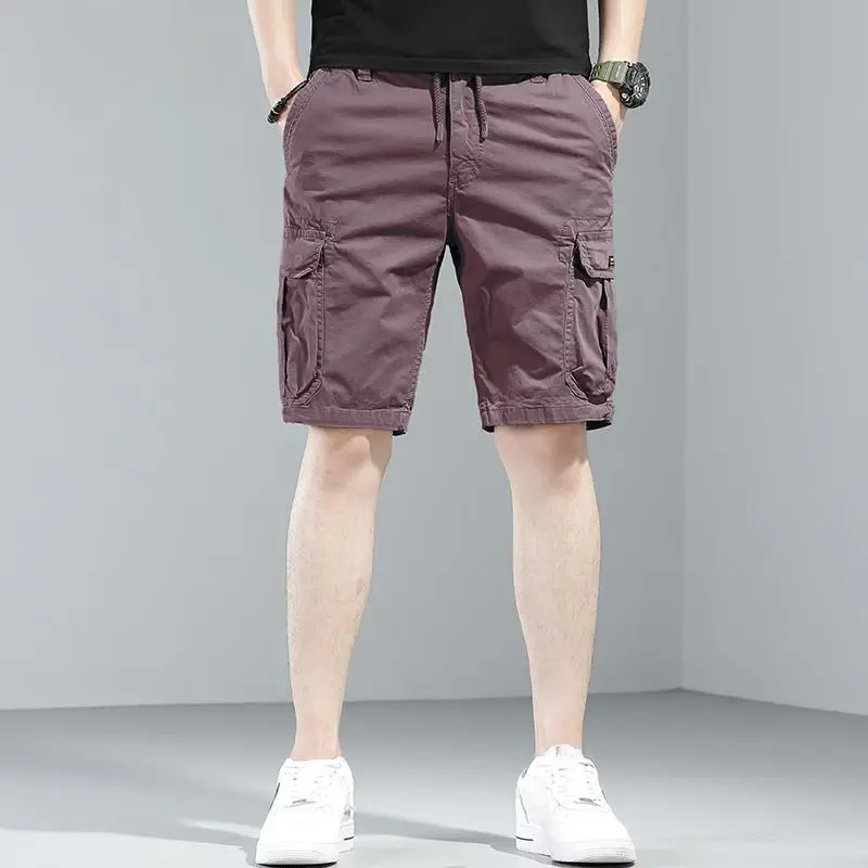 Pantaloni corti maschili bottone solido Multi tasca pantaloncini Cargo da uomo bellissimo Designer Harajuku abbigliamento sciolto spedizione gratuita Vintage