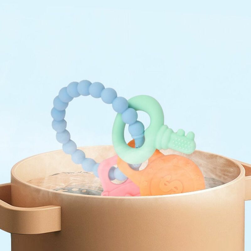 แหวนของเล่นเด็กกัดเล่นมีหลายสีพวงกุญแจซิลิโคนเกรดอาหารเพื่อสุขภาพสำหรับเด็กทารกกัดเล่นแบบพกพาได้